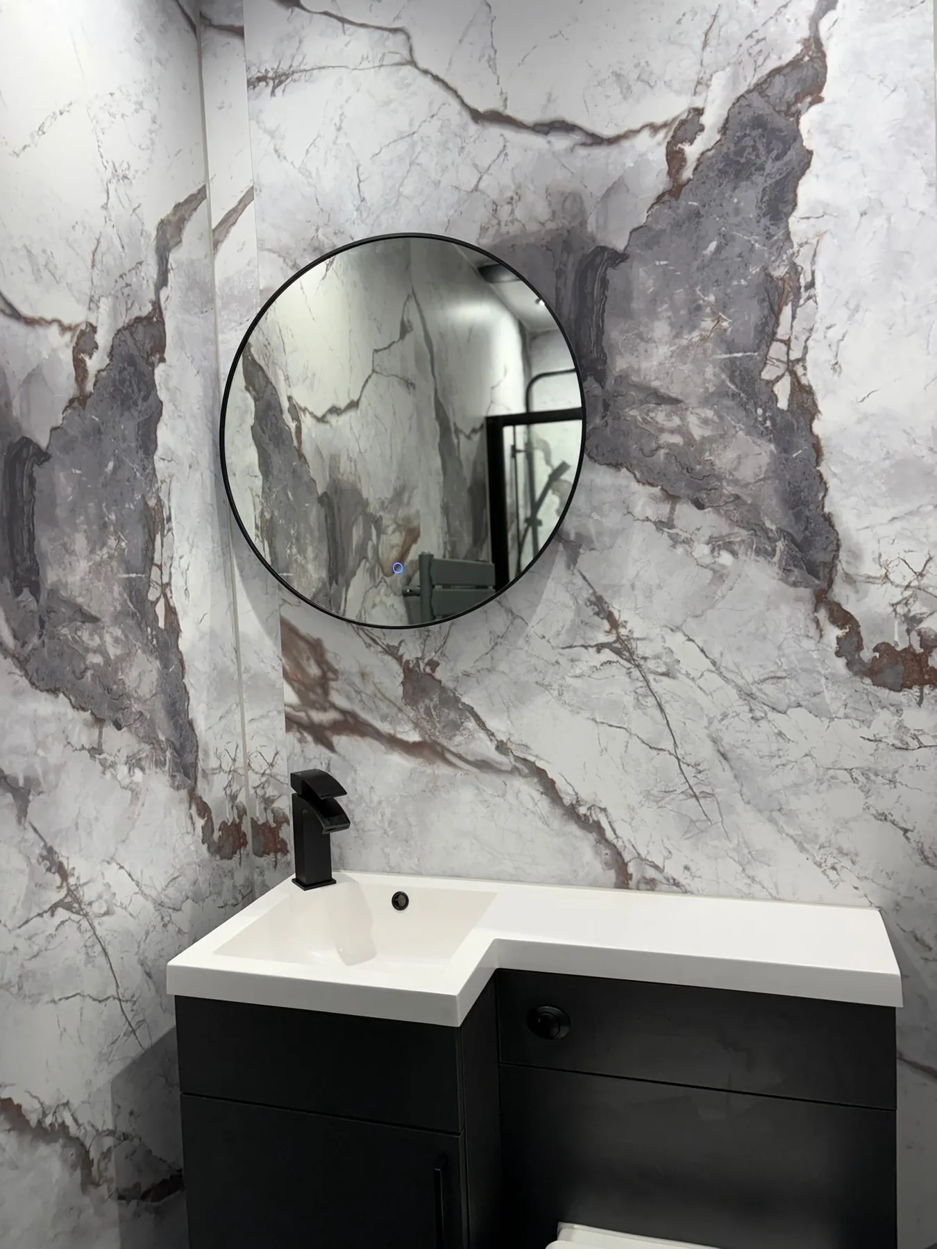 Completed bathroom with dark fittings